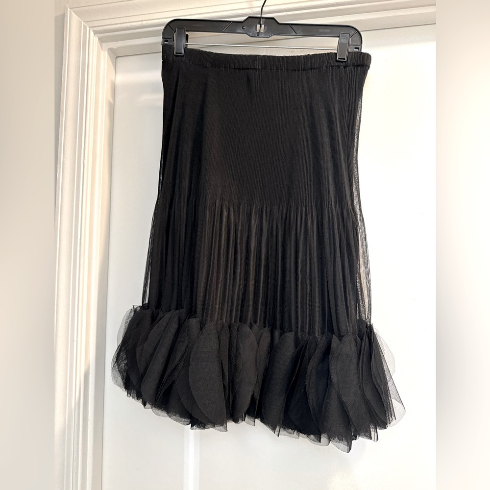 black skirt with petals at the bottom. Unique and cute. pre owned. By Lindi